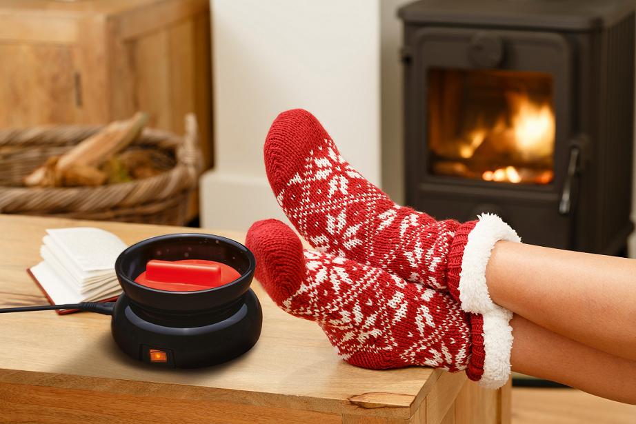 Woman in Christmas socks relaxing next to a wood burning stove