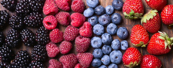 Berries (strawberry , raspberry , blueberries & blackberries ) on wooden background